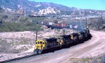 AT&SF, Santa FE GP30 3277 leads a westbound freight, with five other units, down Cajon Pass, Cajon, California. January 22, 1981. 